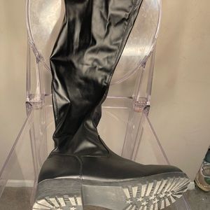 Leather thigh boots.